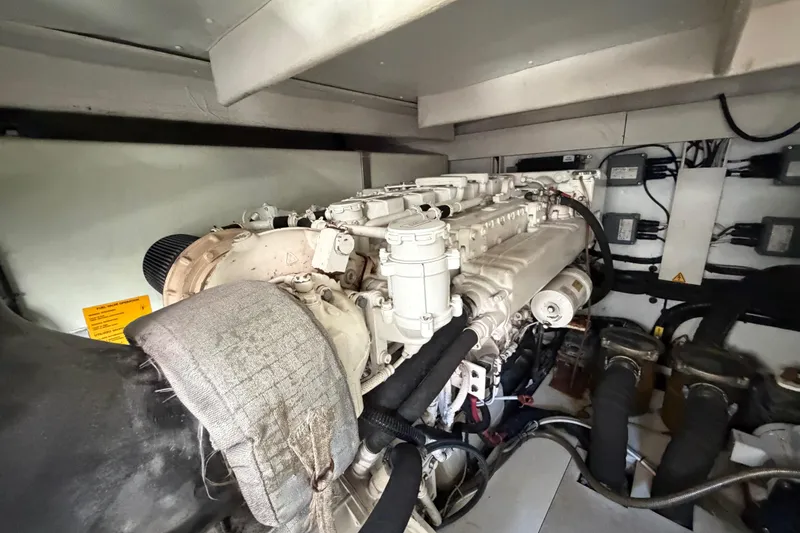 Slide: The Image of Engine room of a 2013 Azimut 60 yacht, showcasing detailed machinery components. - 67