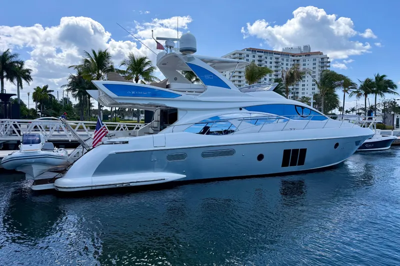 Slide: The Image of Luxury 2013 Azimut 60 yacht docked in a sunny marina with palm trees. - 72