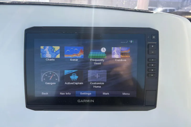 Slide: The Image of Garmin display on 2021 NauticStar 227 XTS boat showing navigation and sonar options. - 19