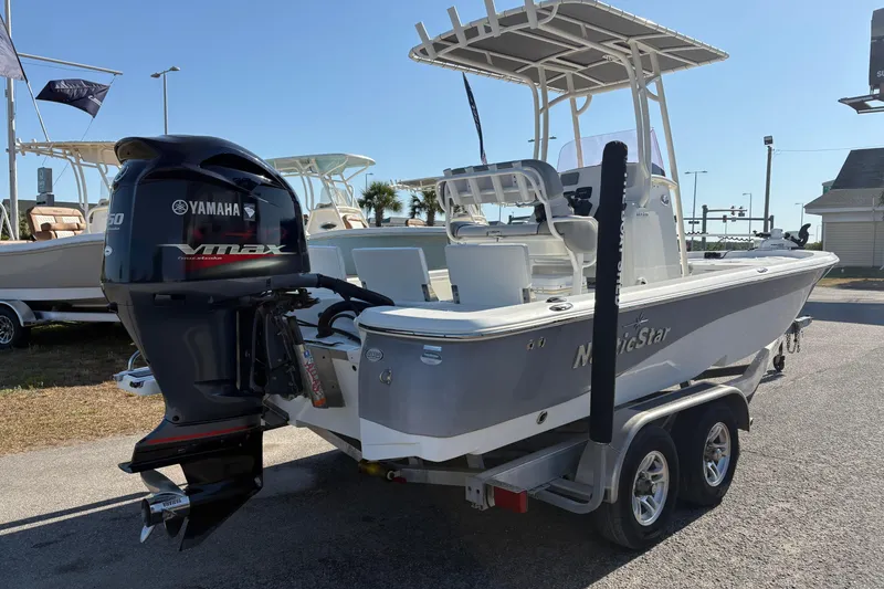 Slide: The Image of 2021 NauticStar 227 XTS boat with Yamaha VMAX engine on trailer. - 2