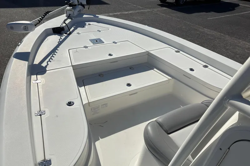 Slide: The Image of 2021 NauticStar 227 XTS boat interior with seating and storage compartments. - 24