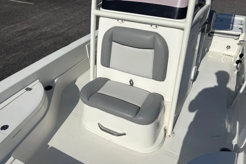 Slide: The Image of 2021 NauticStar 227 XTS boat interior with gray seating and white deck. - 26