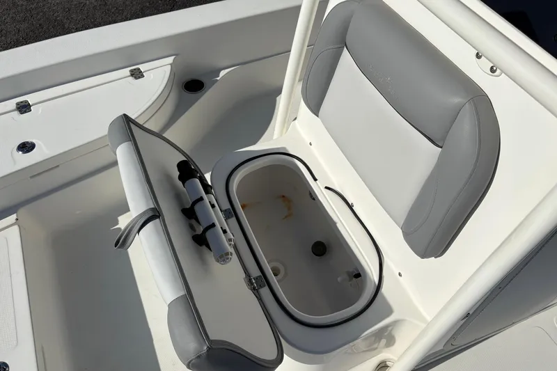 Slide: The Image of 2021 NauticStar 227 XTS boat seat with open storage compartment. - 27