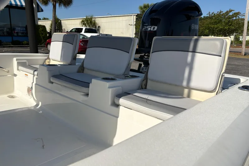 Slide: The Image of 2021 NauticStar 227 XTS boat interior with cushioned seating and Yamaha 250 engine. - 8