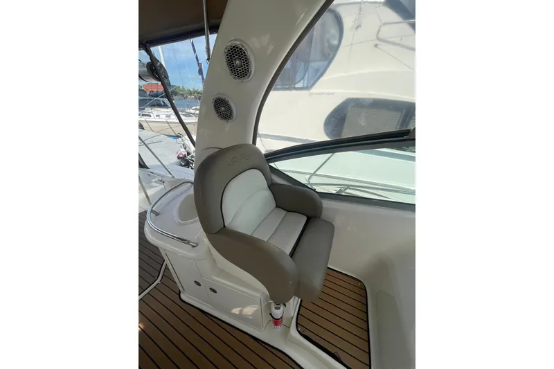 Slide: The Image of Captain's chair on 2003 Sea Ray 340 Sundancer yacht, featuring sleek design and wood flooring. - 15