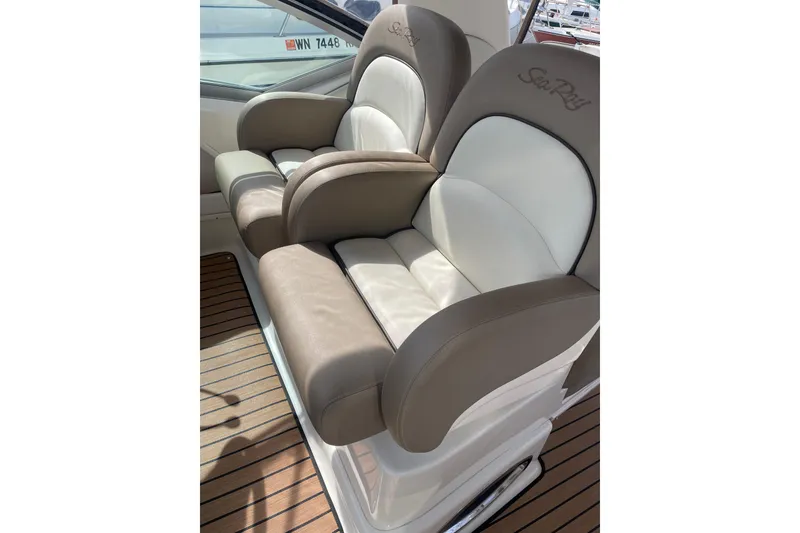 Slide: The Image of Luxury seating on 2003 Sea Ray 340 Sundancer boat, featuring plush, dual-tone upholstery. - 17