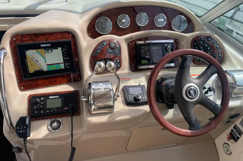 Slide: The Image of Control panel of a 2003 Sea Ray 340 Sundancer boat with navigation instruments. - 19