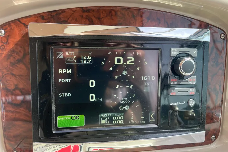 Slide: The Image of Dashboard of a 2003 Sea Ray 340 Sundancer boat with VesselView display. - 25