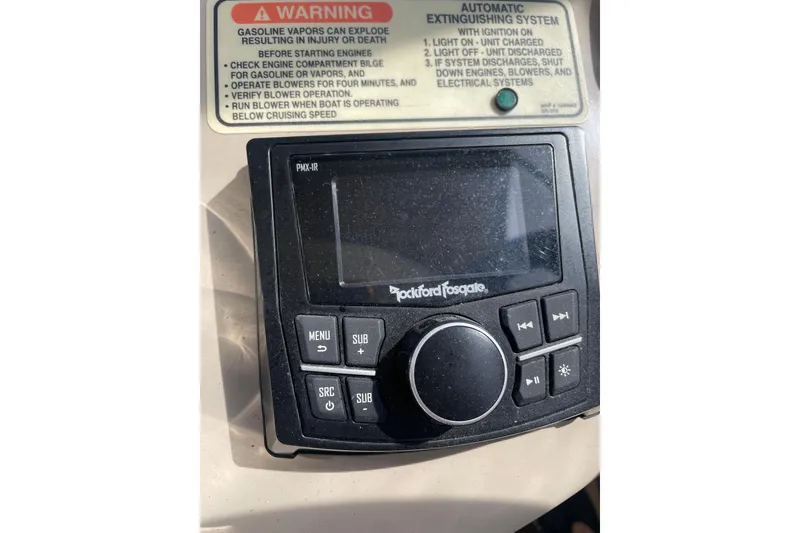 Slide: The Image of Rockford Fosgate audio control panel on 2003 Sea Ray 340 Sundancer boat dashboard. - 26