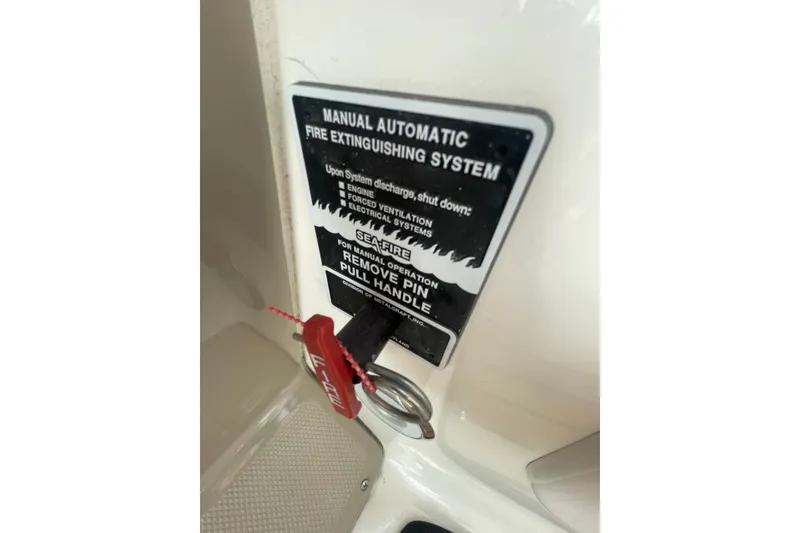 Slide: The Image of Manual automatic fire extinguishing system on 2003 Sea Ray 340 Sundancer boat. - 28