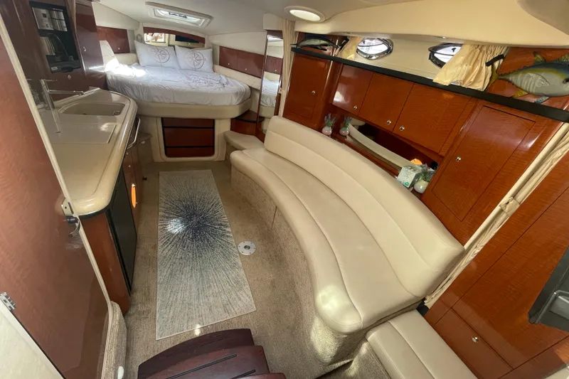 Slide: The Image of Luxurious interior of 2003 Sea Ray 340 Sundancer yacht with cozy seating and elegant wood finishes. - 30