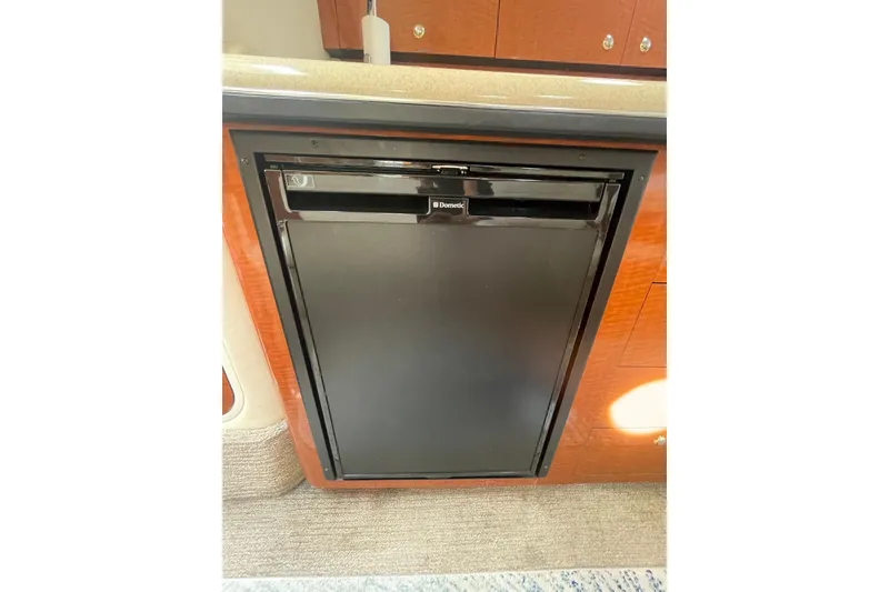 Slide: The Image of Built-in refrigerator on 2003 Sea Ray 340 Sundancer yacht interior. - 34
