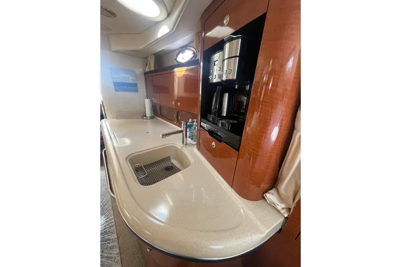 Slide: The Image of Luxurious 2003 Sea Ray 340 Sundancer yacht interior with kitchenette and coffee maker. - 36