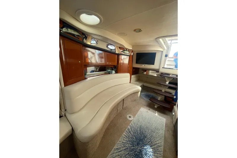 Slide: The Image of Luxurious interior of 2003 Sea Ray 340 Sundancer yacht with plush seating and modern amenities. - 39