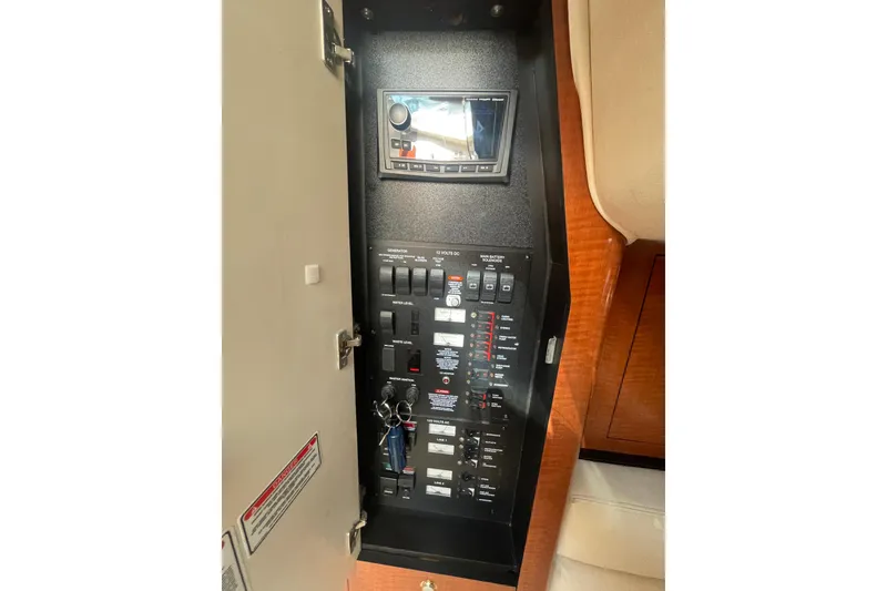 Slide: The Image of Electrical control panel inside 2003 Sea Ray 340 Sundancer boat cabin. - 47