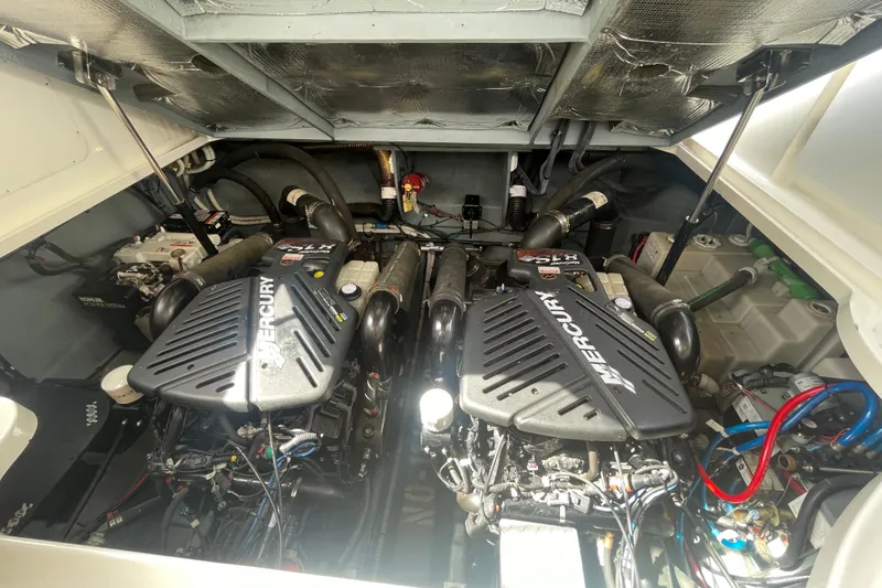 Slide: The Image of Engine room of a 2003 Sea Ray 340 Sundancer with twin Mercury engines. - 49