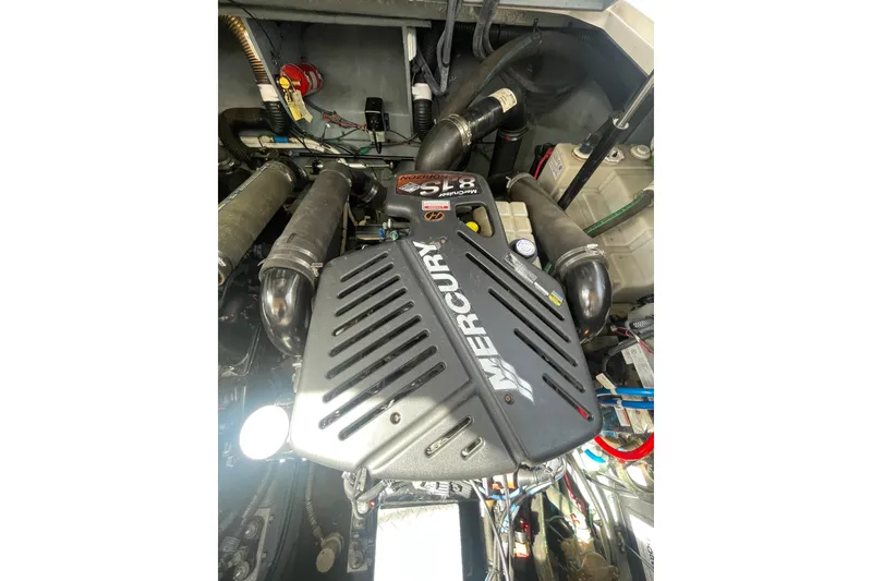 Slide: The Image of Engine compartment of a 2003 Sea Ray 340 Sundancer with Mercury components. - 50