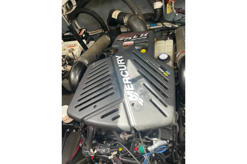 Slide: The Image of Engine of a 2003 Sea Ray 340 Sundancer boat, featuring a Mercury engine. - 55