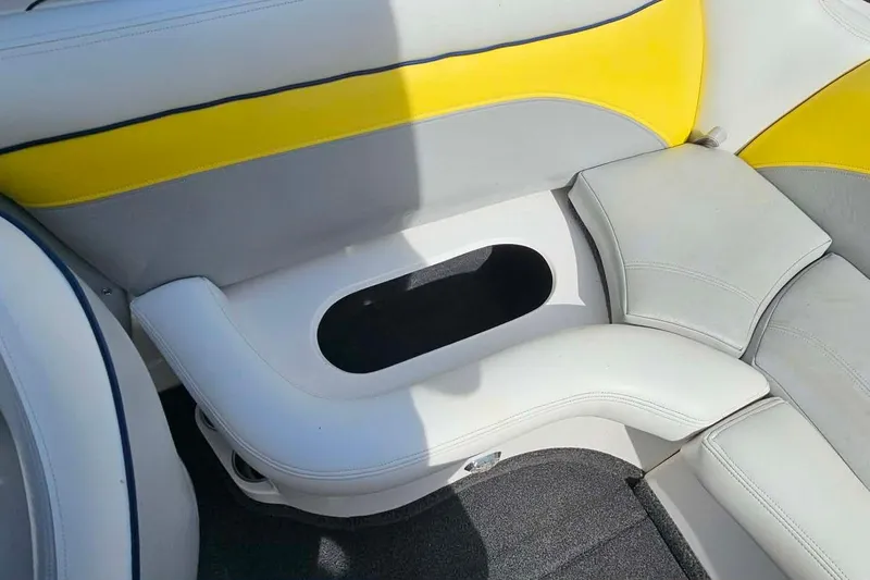 Slide: The Image of 2006 Tigé 22Ve boat interior with white and yellow cushioned seating. - 20
