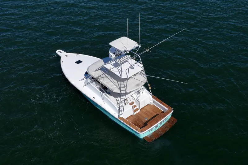 Slide: The Image of Aerial view of 1997 Strike 42 Express boat on open water. - 8