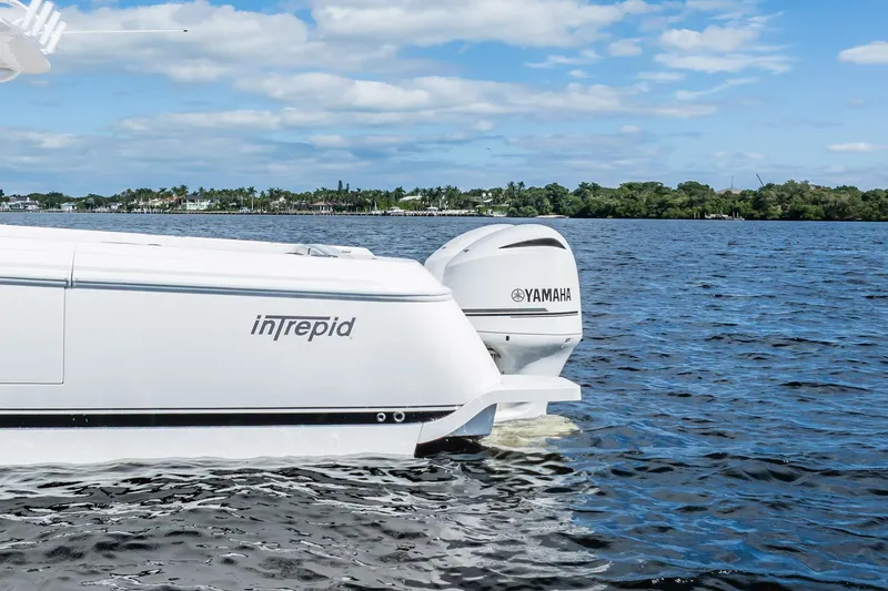 Slide: The Image of 2011 Intrepid 400 Center Console boat with Yamaha engine on water. - 16