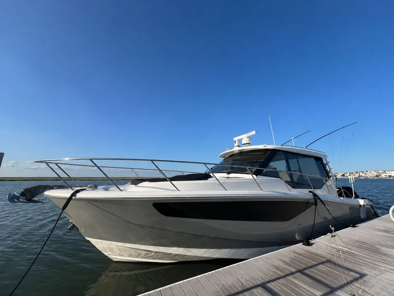 The Image of Boston Whaler 405 Conquest 2023 docked under clear sky. - 0