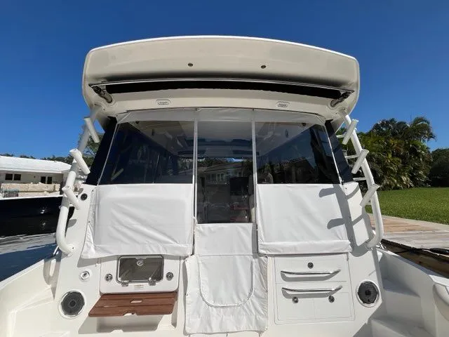 Slide: The Image of Rear view of 2023 Boston Whaler 405 Conquest with enclosed cabin. - 5