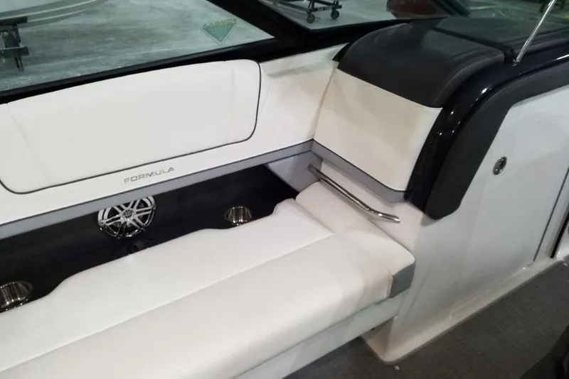 Slide: The Image of 2021 Formula 330 Crossover Bowrider interior with white seating and sleek design. - 13