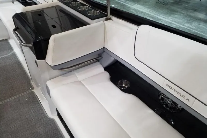 Slide: The Image of Luxurious interior of 2021 Formula 330 Crossover Bowrider with white seating and cup holders. - 15
