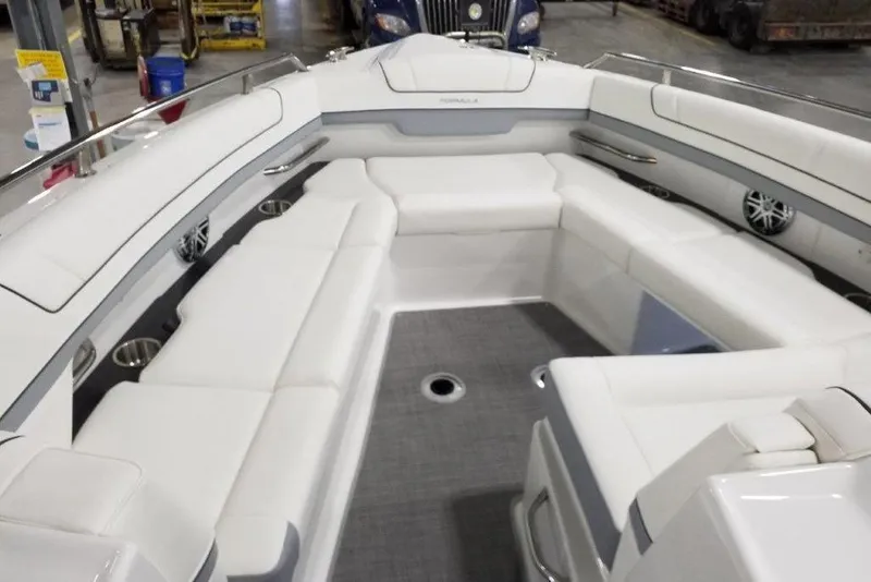 Slide: The Image of 2021 Formula 330 Crossover Bowrider interior with spacious white seating and modern design. - 16