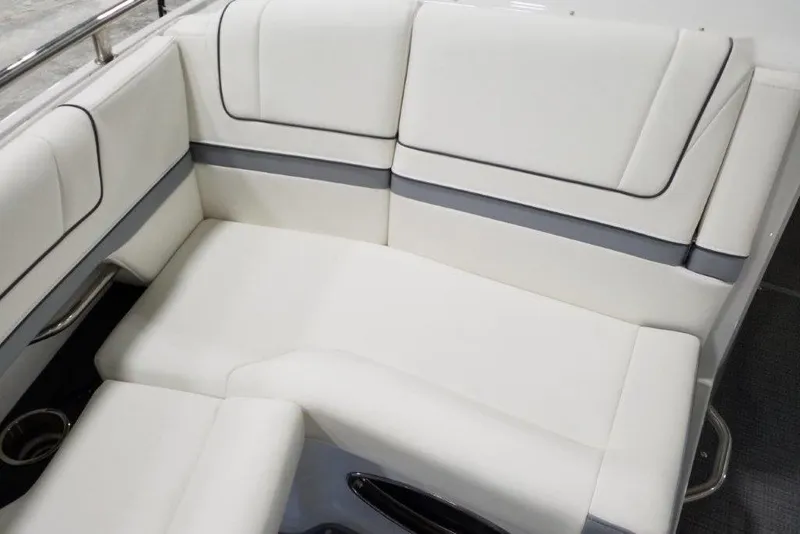 Slide: The Image of Luxurious seating in 2021 Formula 330 Crossover Bowrider boat, featuring sleek white upholstery. - 18