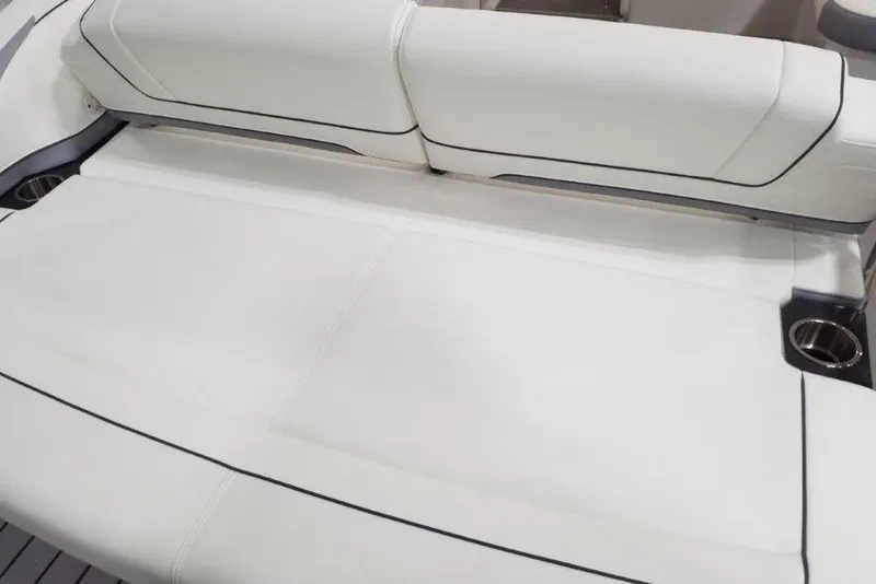 Slide: The Image of 2021 Formula 330 Crossover Bowrider, featuring luxurious white seating with cup holders. - 20