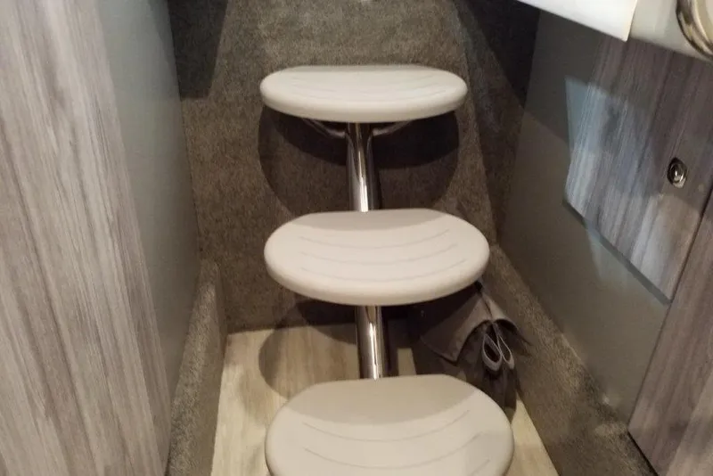 Slide: The Image of Interior steps of a 2021 Formula 330 Crossover Bowrider boat. - 22