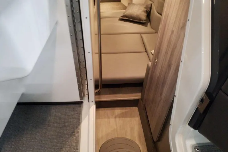 Slide: The Image of Interior cabin view of 2021 Formula 330 Crossover Bowrider with seating and wooden accents. - 23
