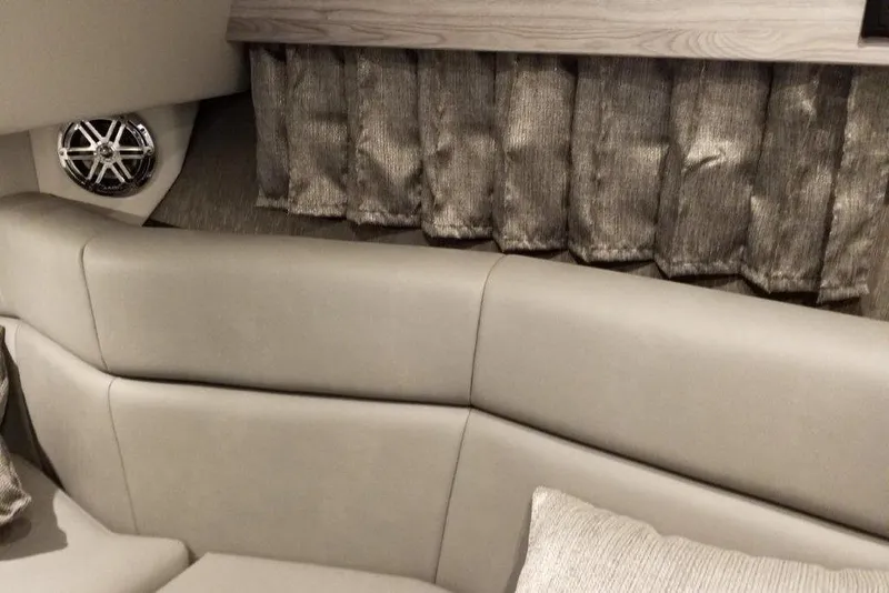 Slide: The Image of Interior of 2021 Formula 330 Crossover Bowrider with plush seating and speaker. - 24