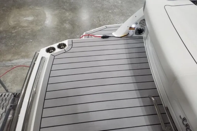 Slide: The Image of 2021 Formula 330 Crossover Bowrider swim platform with cup holders and sleek design. - 5