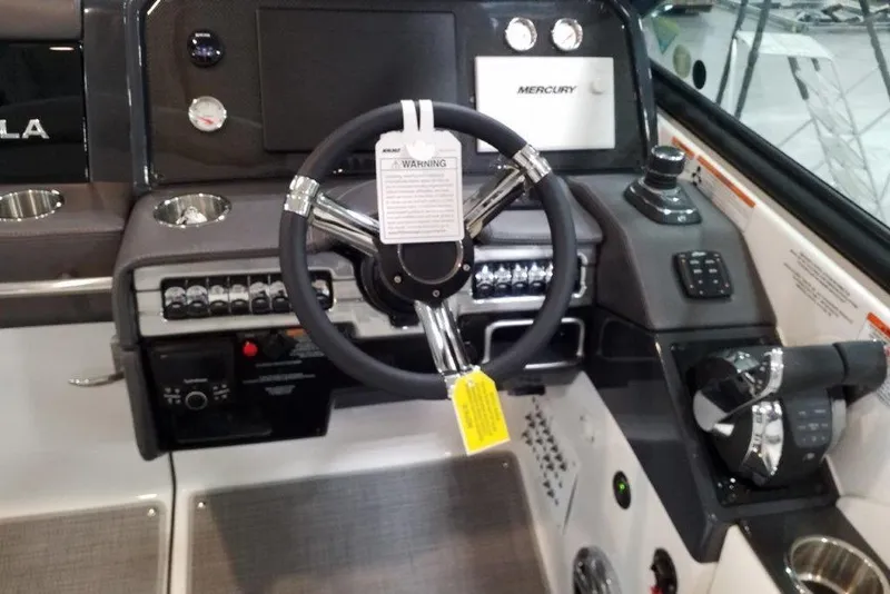 Slide: The Image of Dashboard of a 2021 Formula 330 Crossover Bowrider with steering wheel and controls. - 7