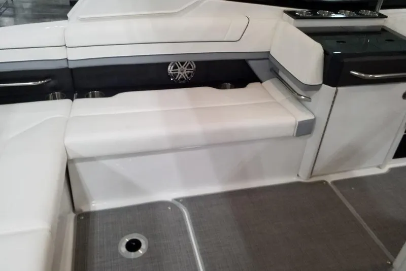 Slide: The Image of 2021 Formula 330 Crossover Bowrider interior with white seating and modern design. - 8