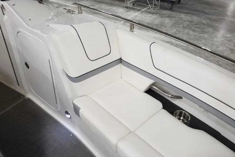Slide: The Image of 2021 Formula 330 Crossover Bowrider interior with white seating and stainless steel accents. - 9