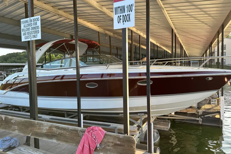 The Image of 2007 Formula 310 Sun Sport boat docked under covered marina. - 1
