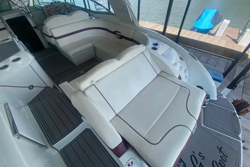 Slide: The Image of 2007 Formula 310 Sun Sport boat interior with white seating and wood accents. - 10