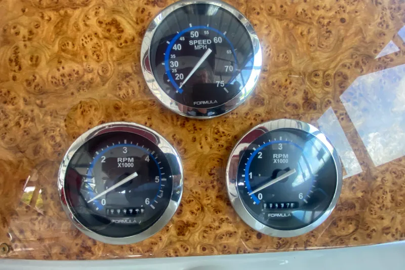 Slide: The Image of Dashboard gauges of a 2007 Formula 310 Sun Sport boat. - 16