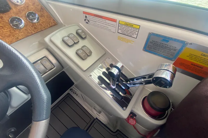 Slide: The Image of Control panel of a 2007 Formula 310 Sun Sport boat with throttle levers and switches. - 17