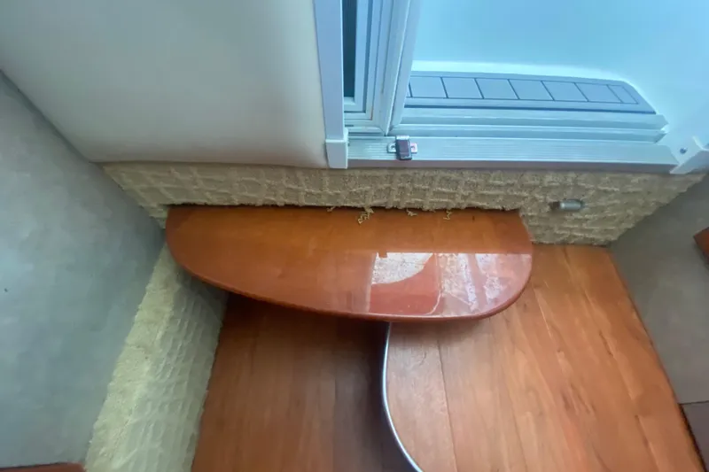 Slide: The Image of Interior of 2007 Formula 310 Sun Sport boat with wooden table and flooring. - 24
