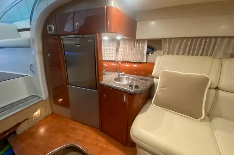 Slide: The Image of Interior of 2007 Formula 310 Sun Sport boat with kitchenette and seating area. - 28