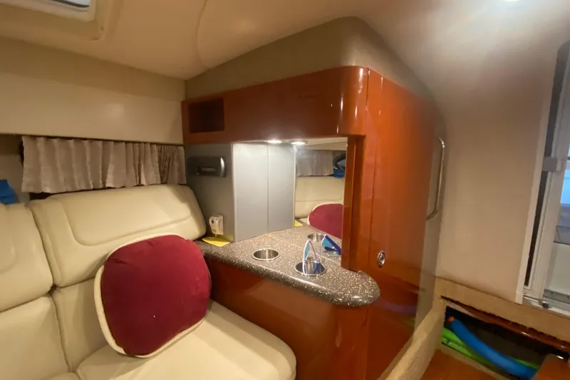 Slide: The Image of Interior of 2007 Formula 310 Sun Sport boat with seating and kitchenette. - 29