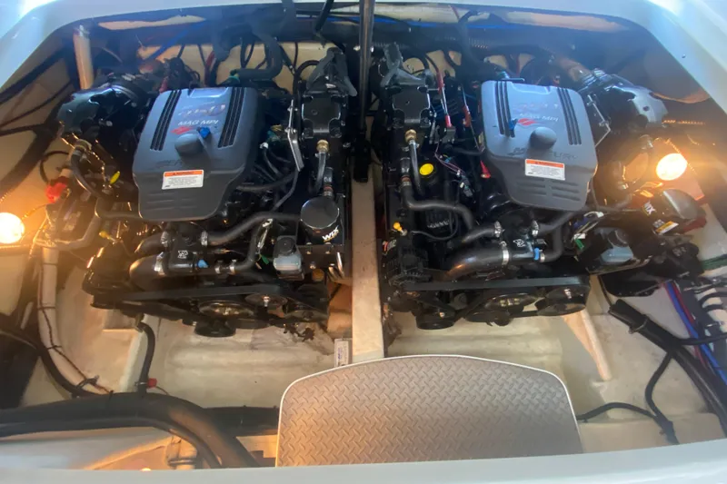 Slide: The Image of Engine compartment of a 2007 Formula 310 Sun Sport boat, featuring dual engines. - 33