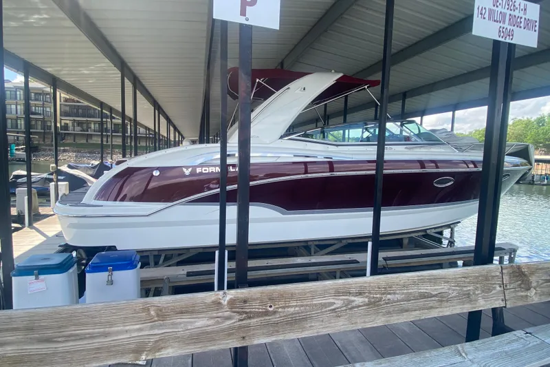 Slide: The Image of 2007 Formula 310 Sun Sport boat docked under covered marina. - 4