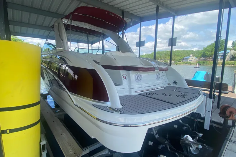 Slide: The Image of 2007 Formula 310 Sun Sport boat docked under a covered marina. - 8