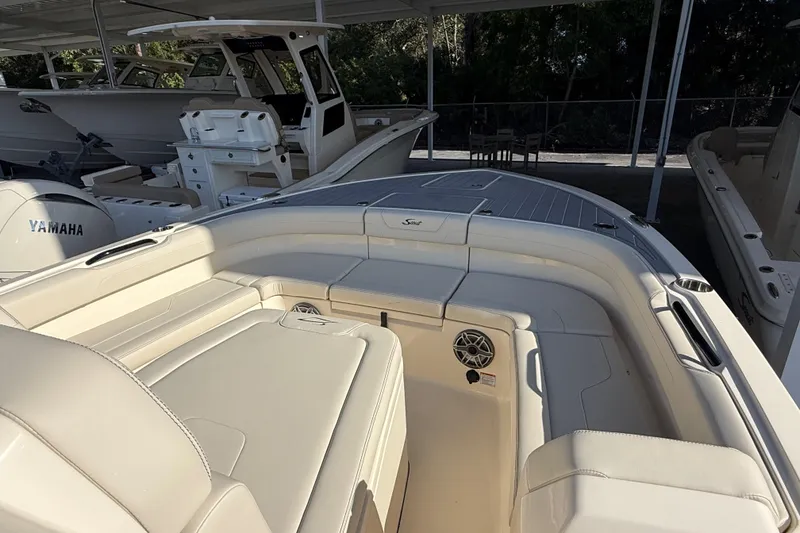 Slide: The Image of 2026 Scout 281 XSS boat interior with Yamaha engine, featuring spacious seating and modern design. - 16